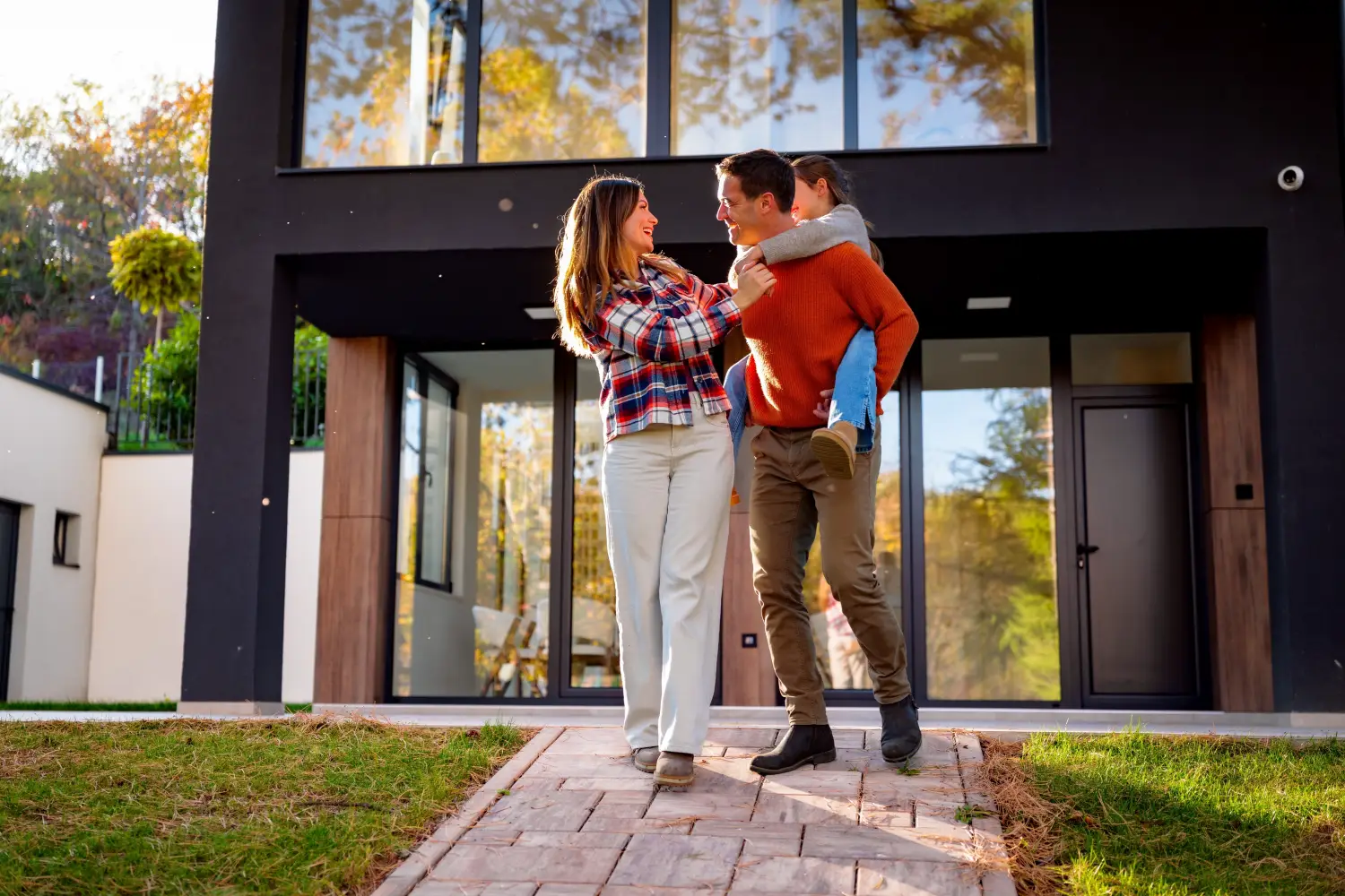 Couple outside their home